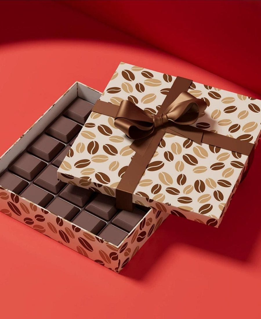 Chocolate gift box with satin bow on red