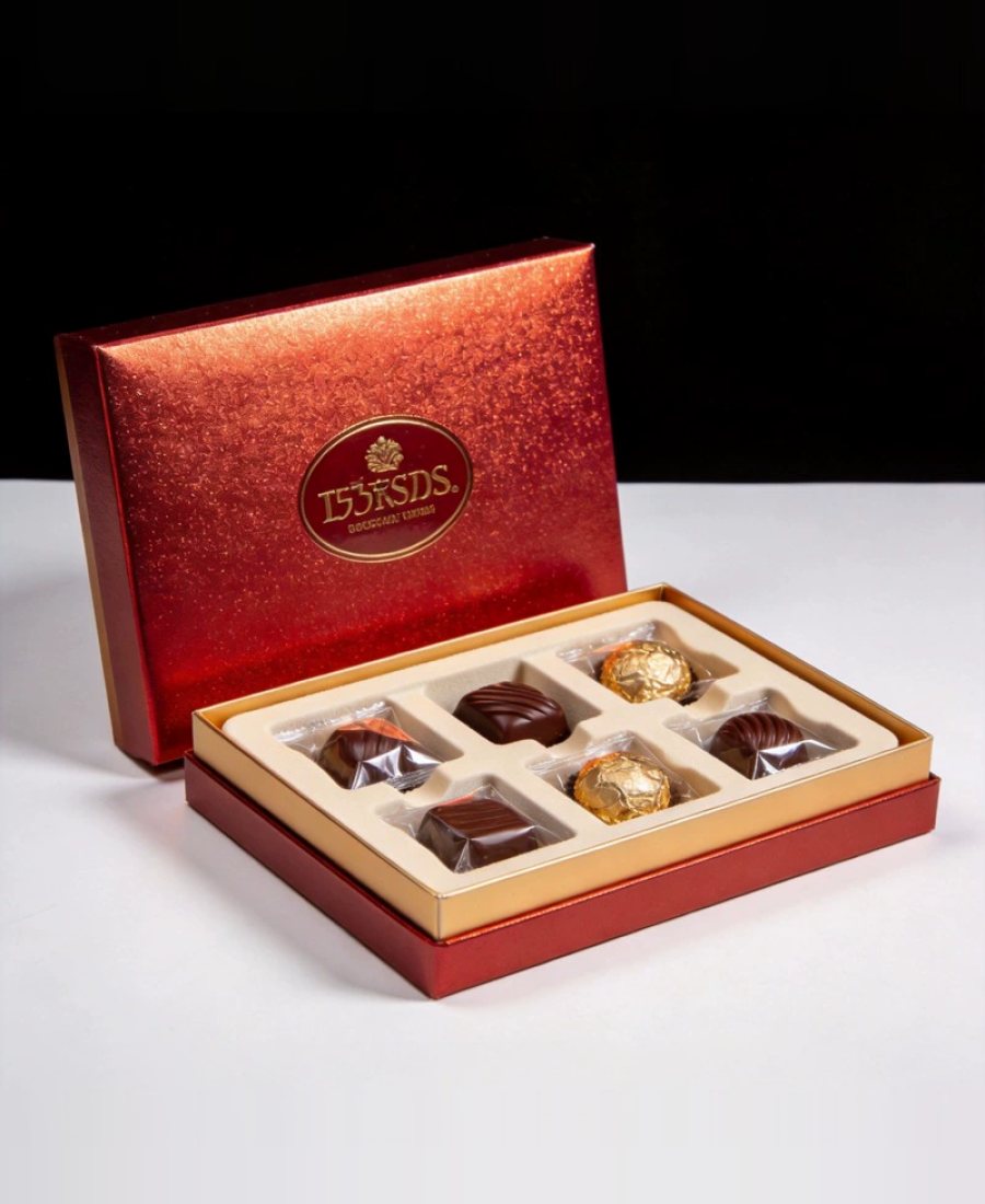 Red and gold lid box with pralines